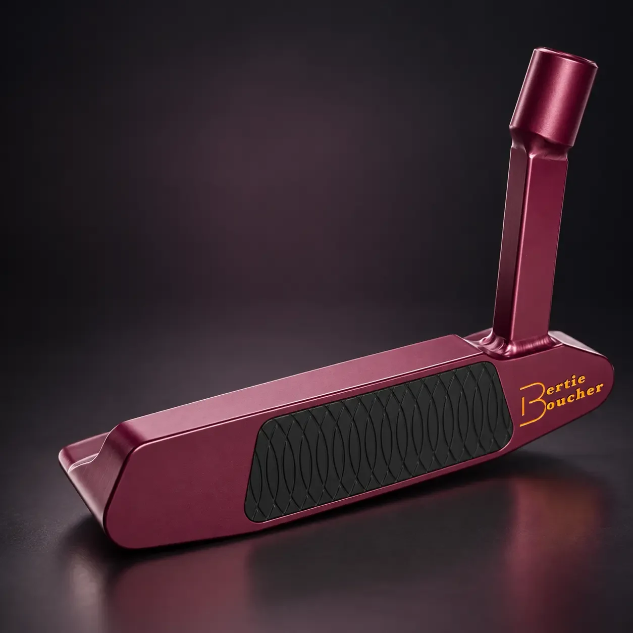 Burgundy Bertie Boucher putter with black milled insert and gold branding