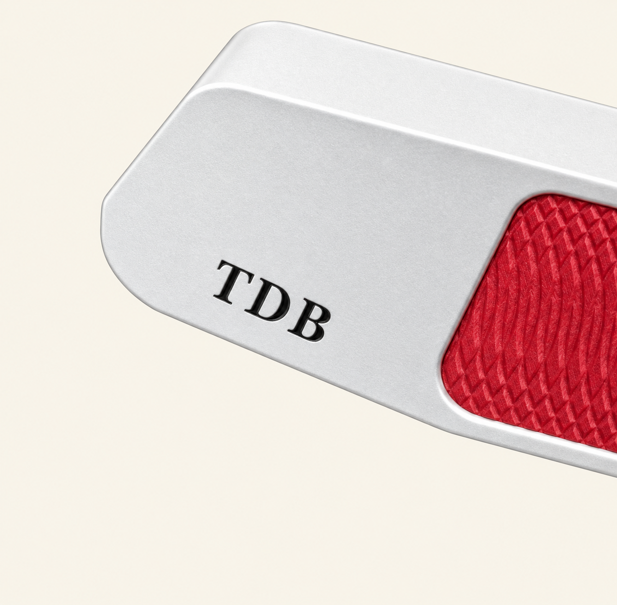 Silver bespoke putter engraved TDB with a red milled insert