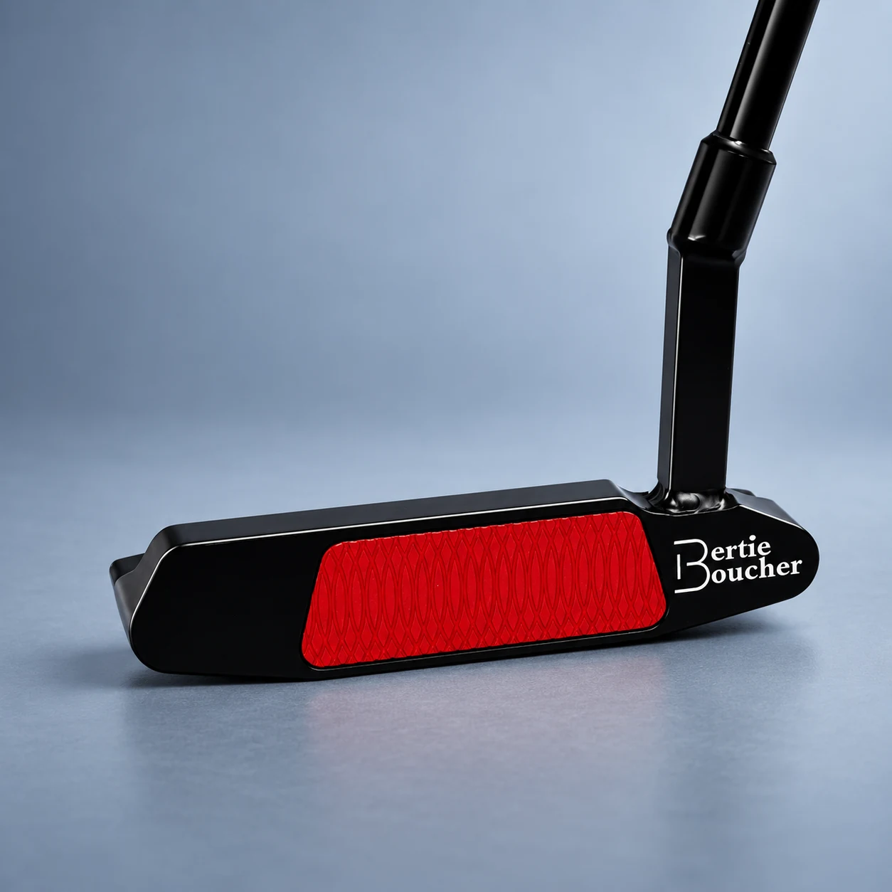 Gloss black Bertie Boucher putter with a bright red milled insert