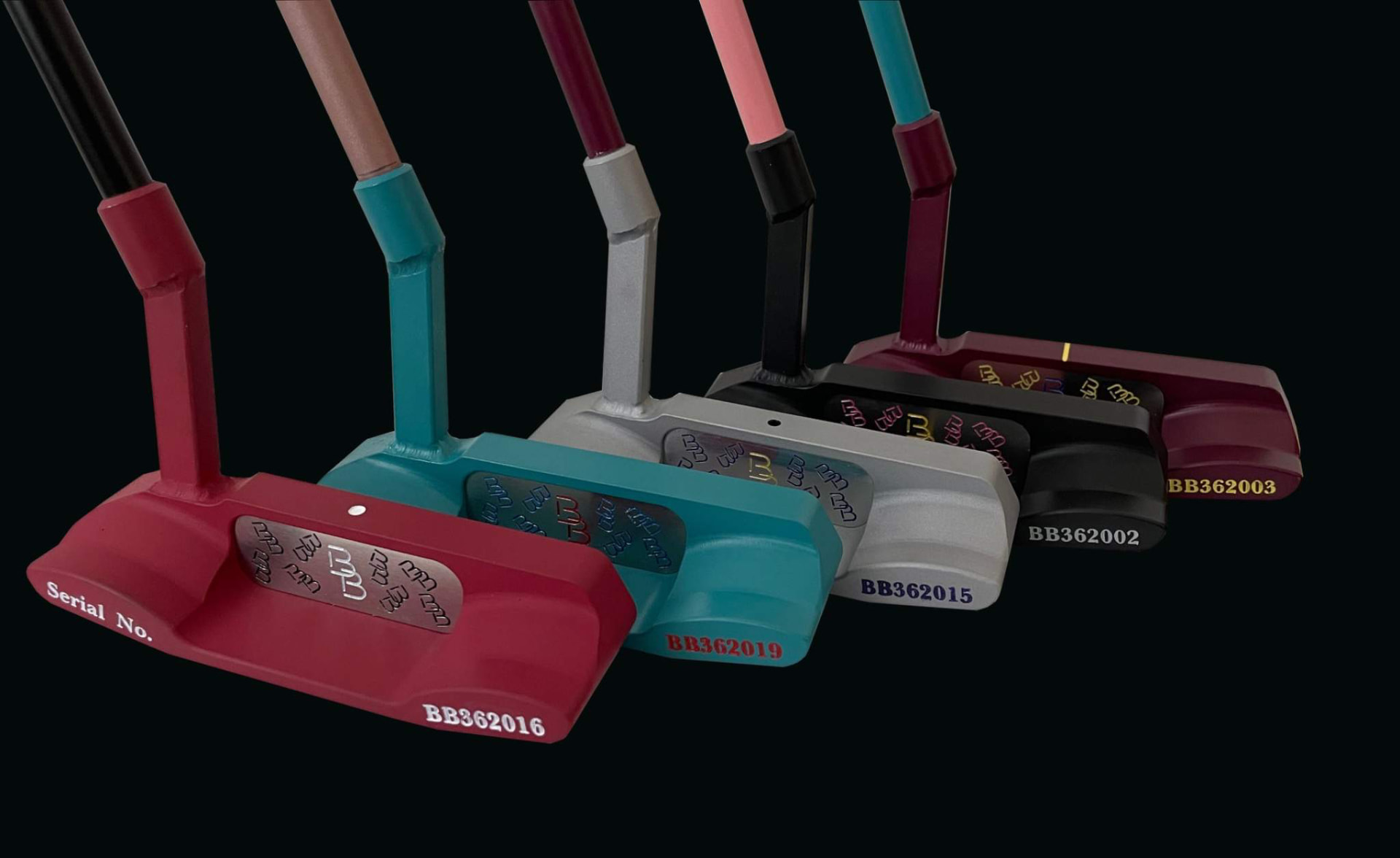 Serial-numbered putter backs in red, teal, silver, black and plum