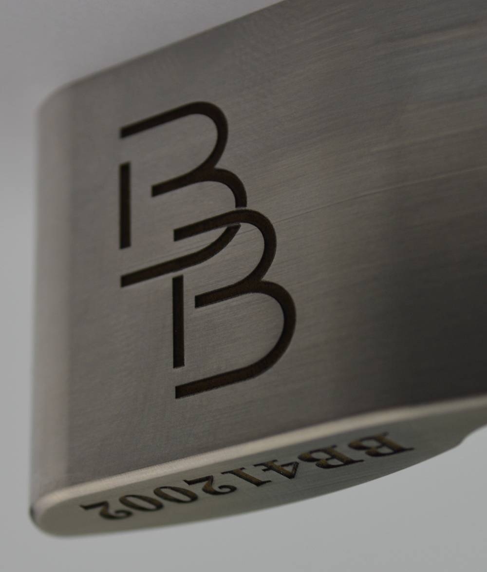 BB monogram engraved on brushed metal putter head